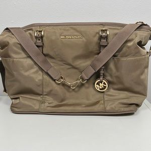 Michael Kors diaper bag, thick sturdy nylon, and spacious lots of compartments.